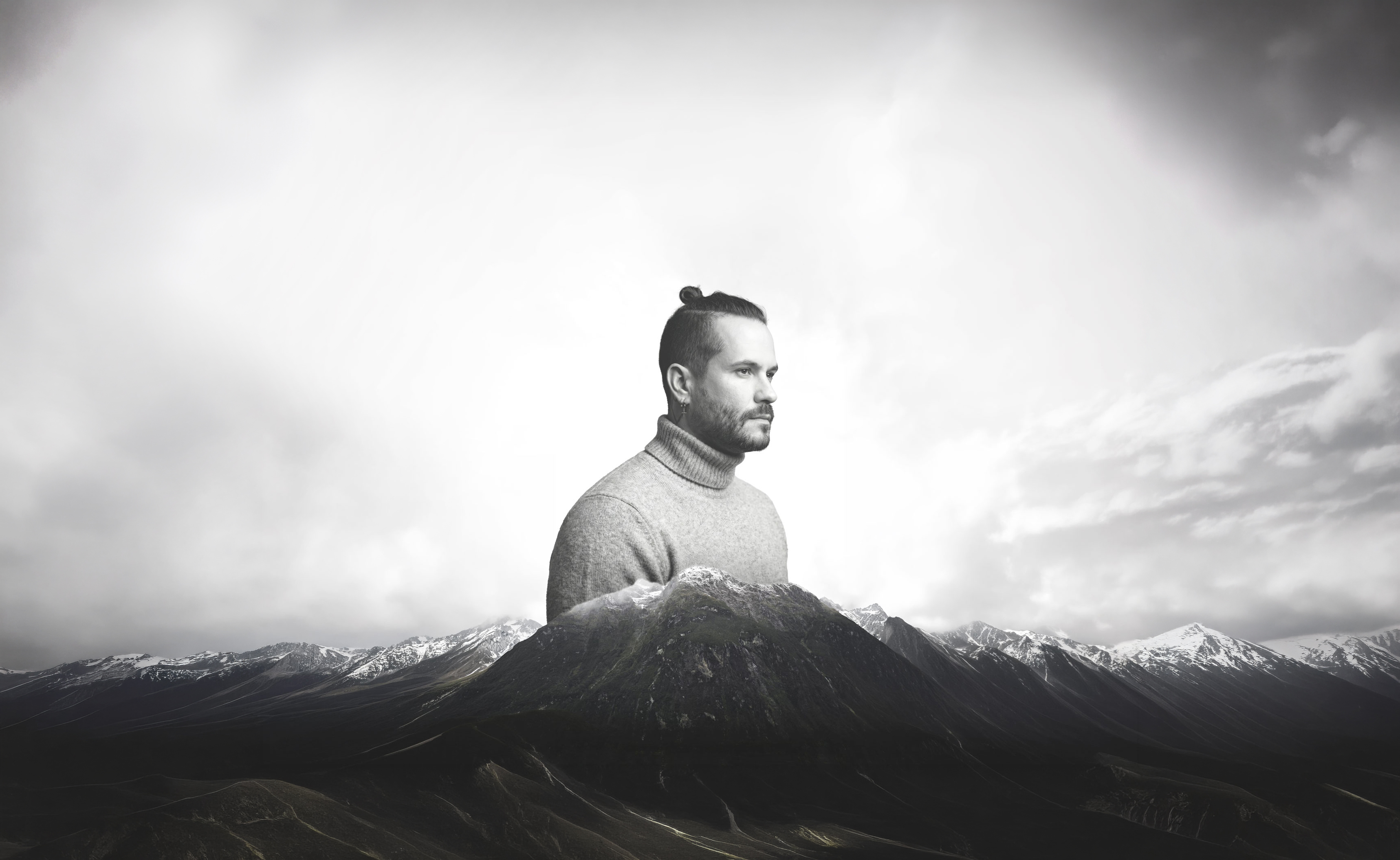 Néstor Araujo portrait integrated into a black and white mountain landscape